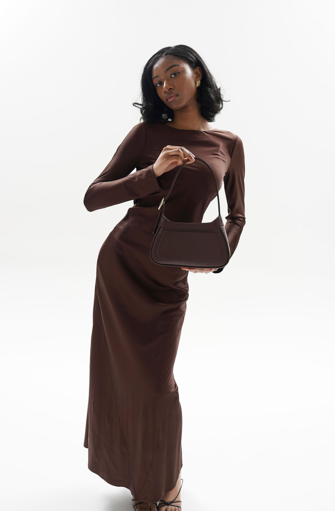 refined dark brown shoulder bag with gold hardware, suited for daily wear and occasions