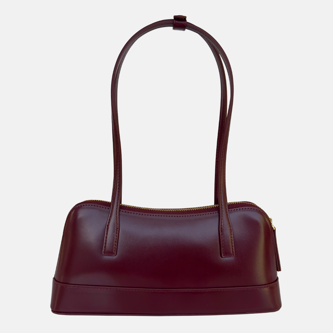 dark red handbag east west style shoulder bag with long straps and minimal hardware