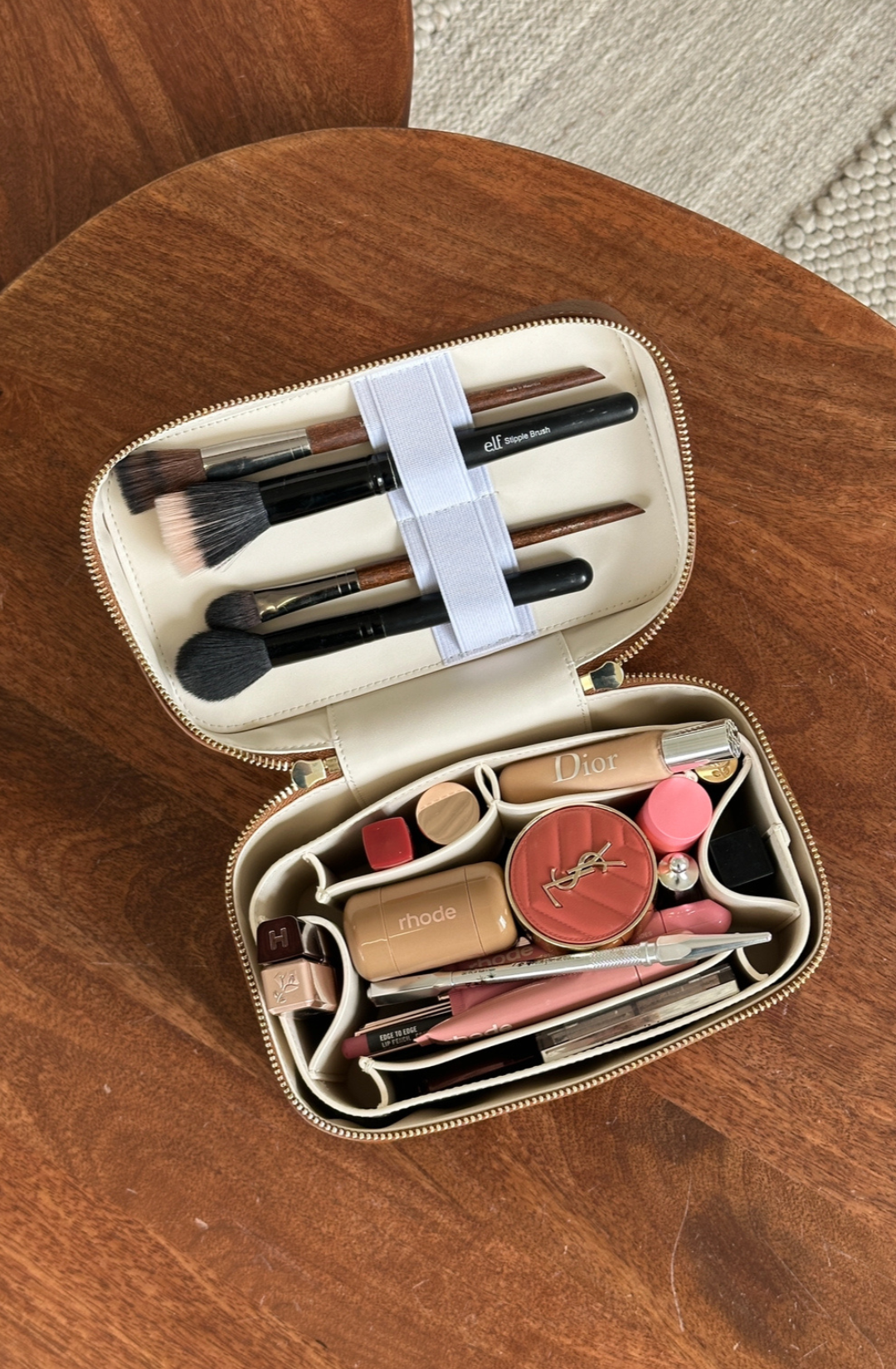 Structured black vanity case holding makeup essentials