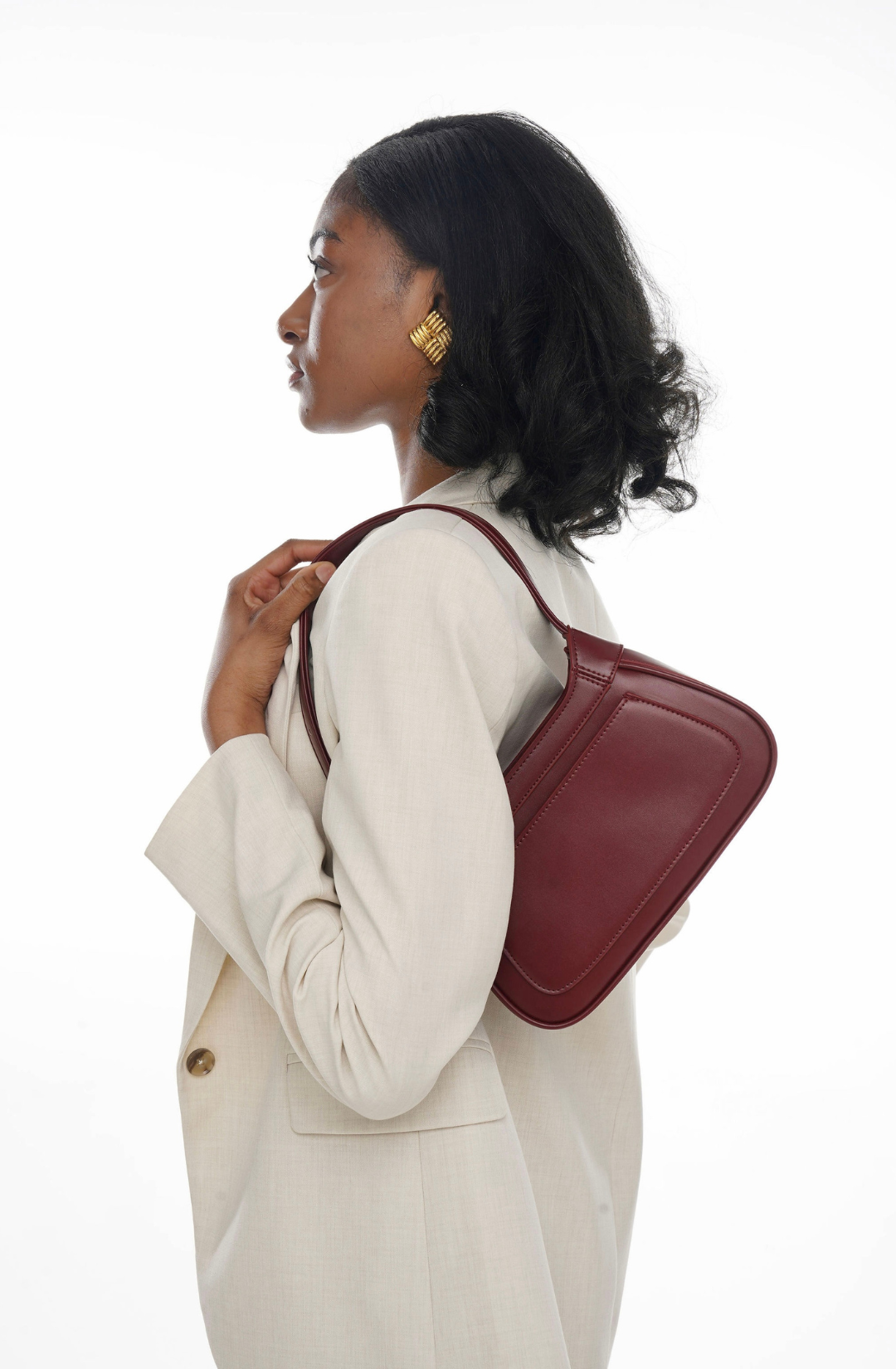 cherry red shoulder bag with structured shape, designed for day to evening wear