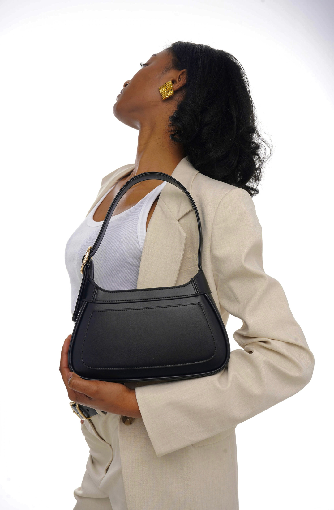 minimal black shoulder bag with gold hardware, an elevated everyday essential