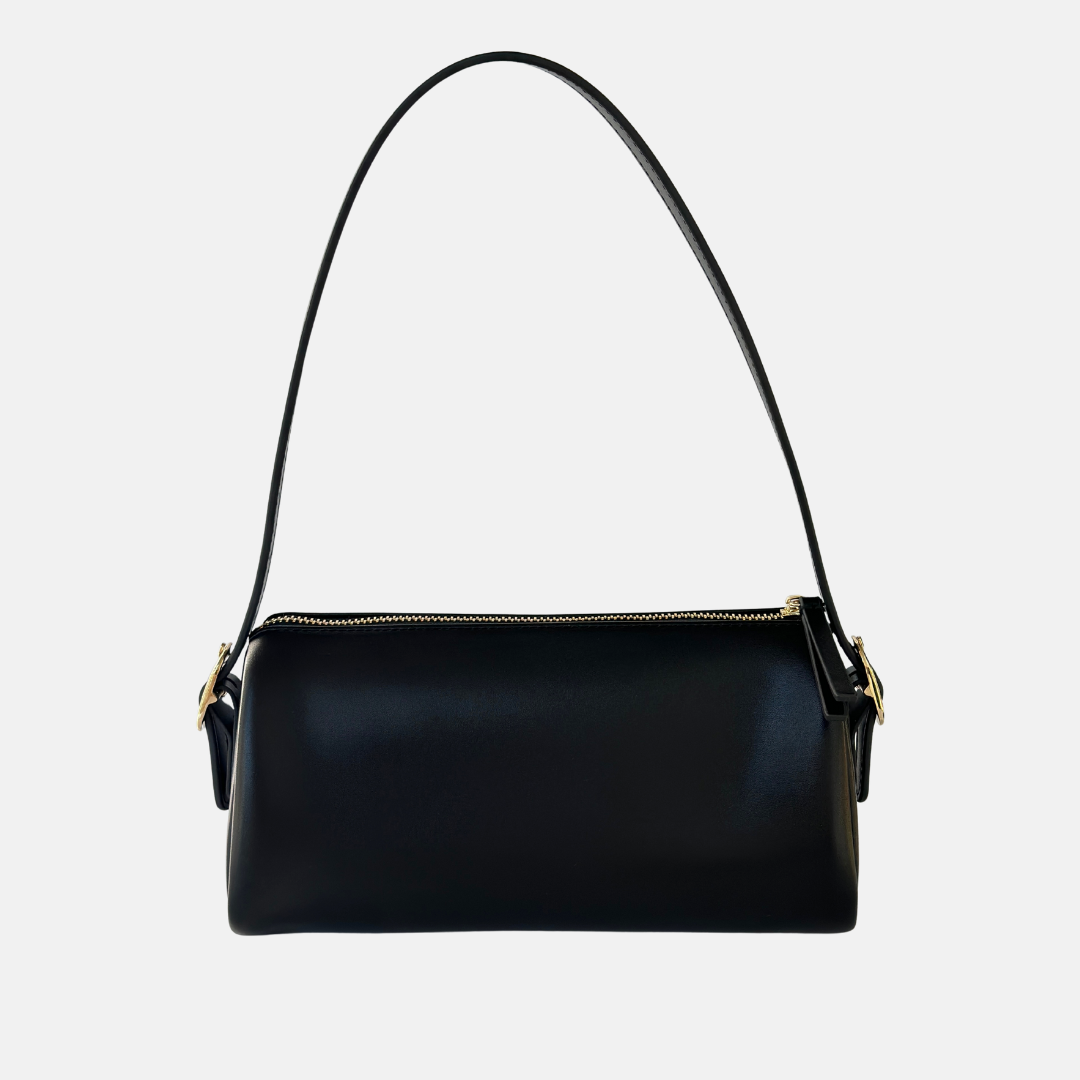 Black handbag with a adjustable strap and gold buckle