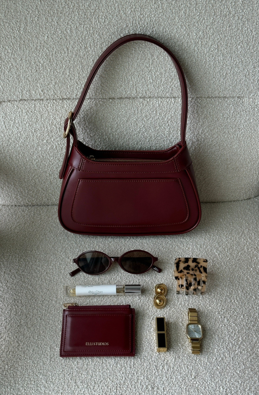 rich burgundy shoulder bag with gold hardware, an elevated option for evenings and events