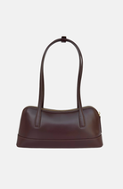 brown handbag east west style shoulder bag with long straps and minimal hardware