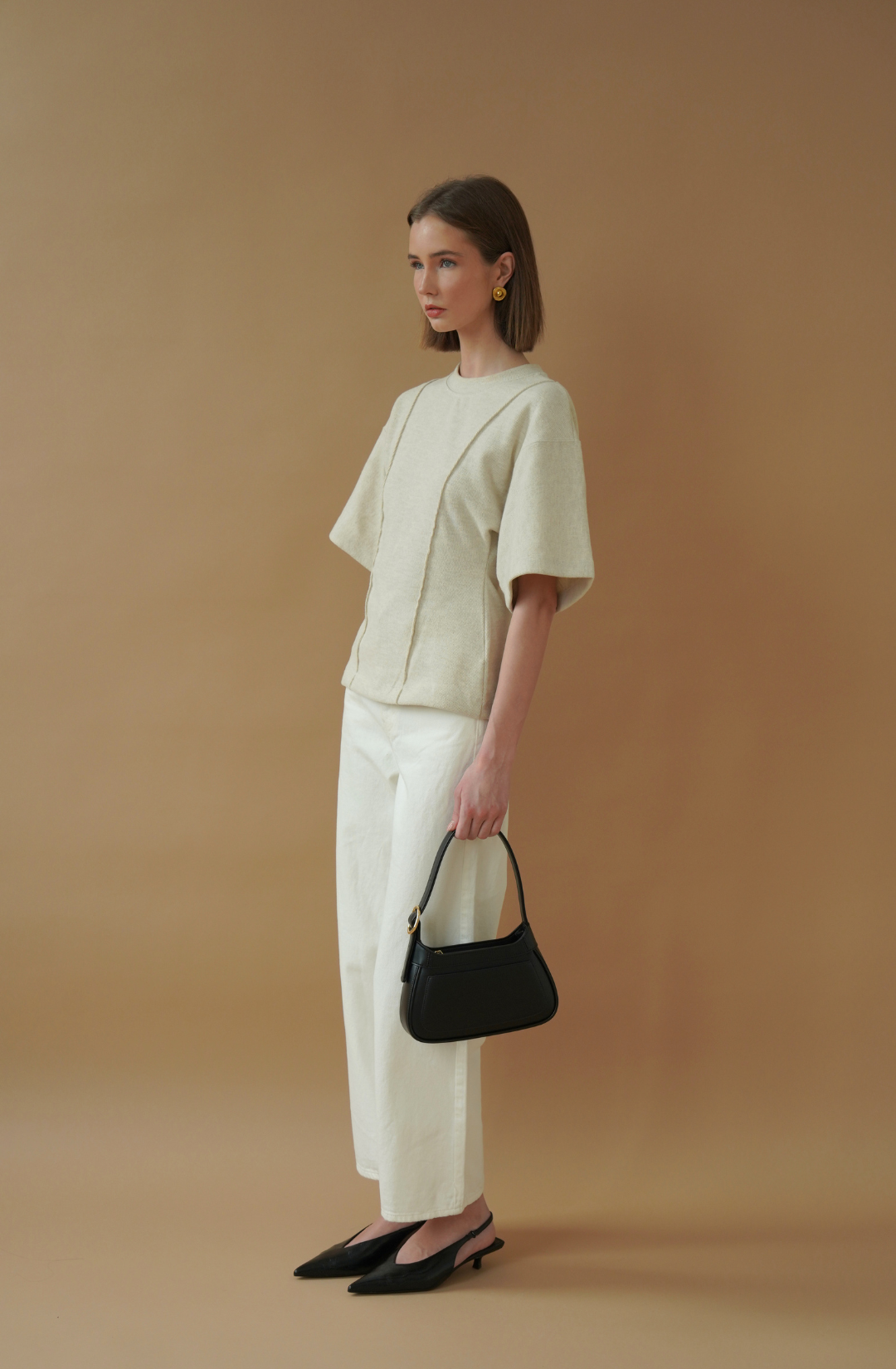 minimal black shoulder bag designed for everyday wear, from work to evening outings